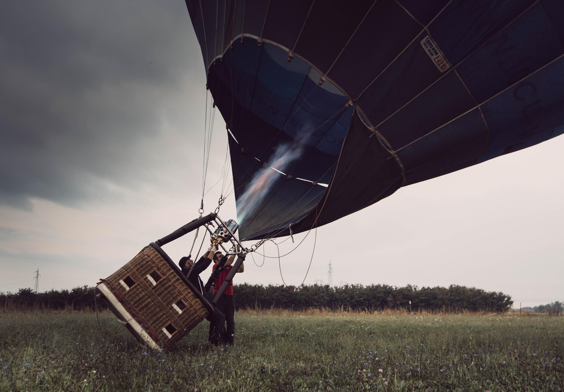 A hot air balloon being inflated at dawn — the kind of dream worth unlocking.